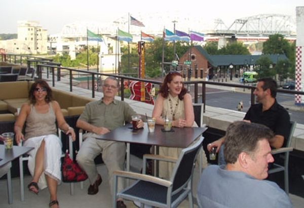 Tim and Kathleen O'Brien and other party guests on the rooftop outside the Reverb Roo Photo